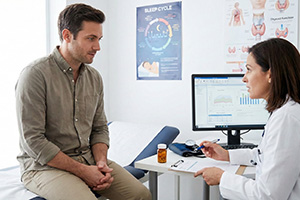 Patient consulting with a doctor about modafinil safety and underlying sleep conditions before buying treatment online.